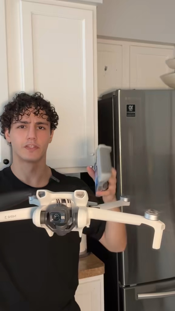 Wesam showing the DJI Mini 3 drone and controller