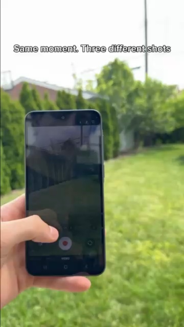Samsung phone demonstrating its camera outdoors